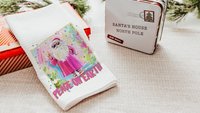 hippie Santa throw pillows for couch, peace on earth kitchen towels for Christmas, hot pink Santa Claus holiday hosting decor home decor