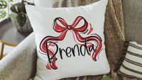 personalized Christmas coquette throw pillow with name, red and green Christmas bow accent pillow for couch, whimsical Christmas gifts for