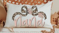 personalized blush pink nana throw pillow for bed, leopard print bow coquette pillow cover 12 by 20, mother in law mothers day gifts