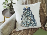 CapableByDesign oyster shell Christmas tree with navy bow pillows and matching towels