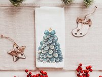 CapableByDesign oyster shell Christmas tree with aqua bow pillows and matching towels