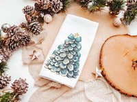 CapableByDesign oyster shell Christmas tree with aqua bow pillows and matching towels