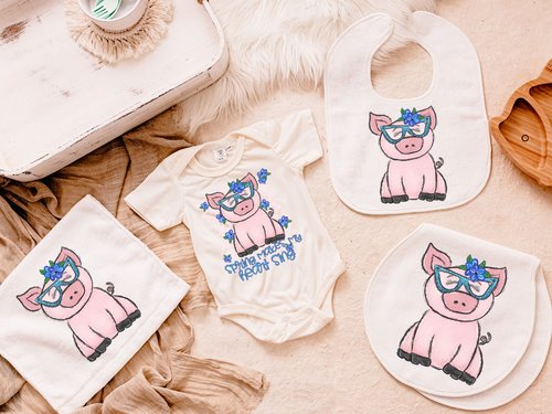 CapableByDesign pig baby bodysuit, bib, peanut burp cloth, and carry with me lovey blanket